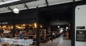 Historic Market Hall Reopens After Lengthy Restoration traders and shoppers in market hall