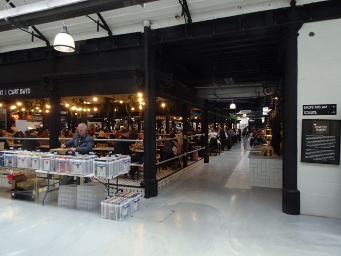 Historic Market Hall Reopens After Lengthy Restoration traders and shoppers in market hall