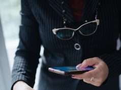 Crypto Wallet Apps Warn Users Before Risky Transfers a smartphone showing a crypto wallet app