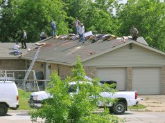 Roof Repair Grants Target the Oldest Terraces First worker repairing the roof of a house