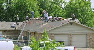 Roof Repair Grants Target the Oldest Terraces First worker repairing the roof of a house